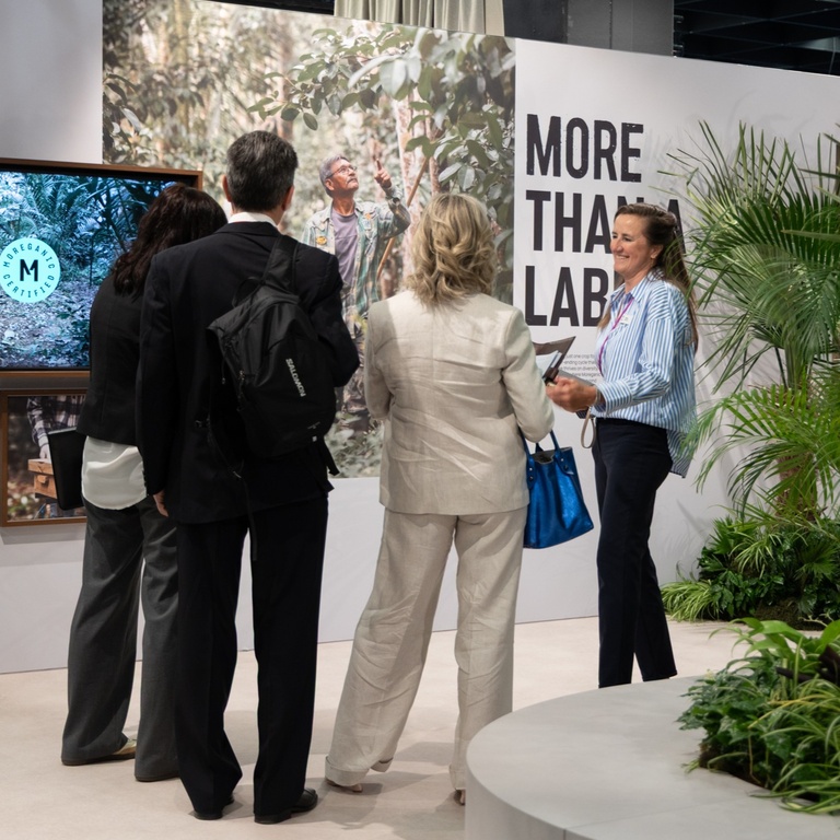 salesperson from novaya explaining moreganic